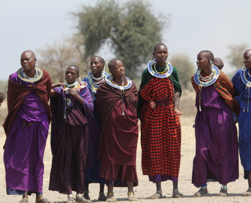 a group of Maasai women in very colorful clothing in the Ngorongoro Conservation area