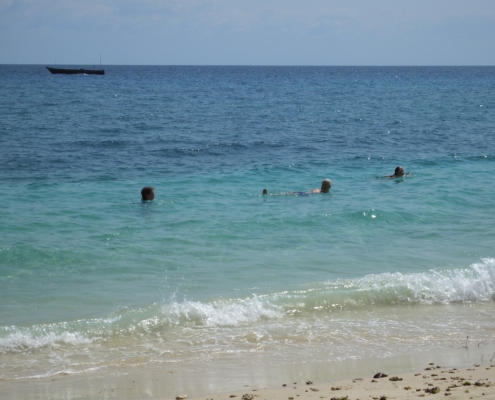 People swimming in the turquoise waters off Changuu Island (Zanzibar)